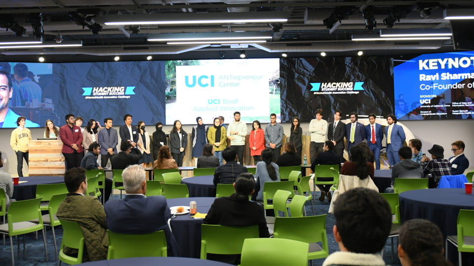 student finalist teams standing on the stage at the finale of the UCI ANTrepreneur Center Mental Health Hackathon